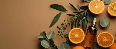 dois laranjas e uma garrafa do perfume em uma mesa foto