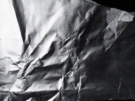 a superfície da textura da folha de alumínio para materiais de fundo e design. coleção de textura amassada de folha de prata. fundo abstrato enrugado foto