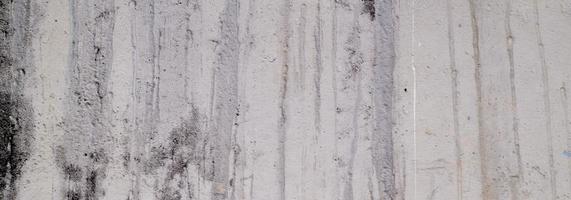 parede texturizada com cinza. textura de cimento de concreto ligeiramente cinza claro para o fundo. textura de pintura abstrata.