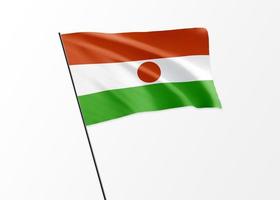 Bandeira do Níger voando alto no dia da independência do Níger de fundo isolado. Coleção da bandeira nacional mundial ilustração 3D foto