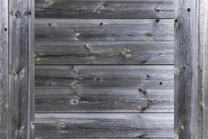 uma moldura de uma cerca de madeira cinza velha e temperada, close-up foto