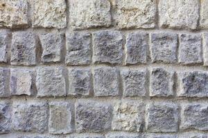 parede de pedra de um grande close-up de paralelepípedo de arenito foto