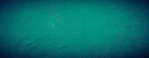 fundo de textura de parede de concreto abstrato sujo verde esmeralda escuro, plano de fundo panorâmico foto