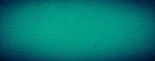 fundo de textura de parede de concreto abstrato sujo verde esmeralda escuro, plano de fundo panorâmico foto