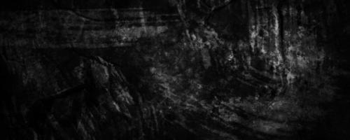 fundo desfocado de cimento de concreto preto com rachaduras cinza escuro e rugas amassadas foto
