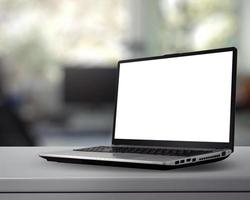 laptop com tela em branco na mesa branca com fundo desfocado como conceito foto