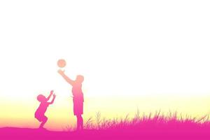 meninos jogando futebol ao pôr do sol. conceito de silhueta foto