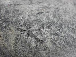 textura de superfície de pedra cinza preta com foco suave foto