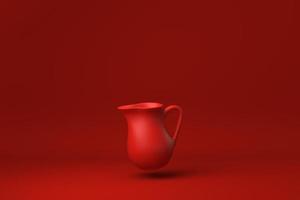 jarro vermelho ou jarro de leite flutuando em fundo vermelho. ideia de conceito mínimo criativa. monocromático. renderização 3D. foto