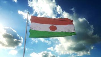 bandeira da república do niger balançando ao vento contra o lindo céu azul. renderização em 3D foto