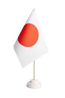 bandeira de mesa pequena do japão isolada no fundo branco foto