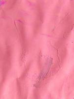 textura de tinta de cor rosa sobre fundo de papel. papel de parede. foto