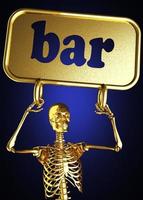 palavra bar e esqueleto dourado foto