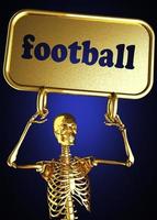 palavra de futebol e esqueleto dourado foto