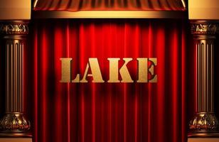 palavra dourada do lago na cortina vermelha foto