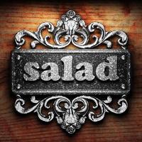 palavra de salada de ferro em fundo de madeira foto