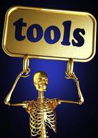 palavra de ferramentas e esqueleto dourado foto