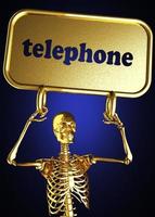 palavra de telefone e esqueleto dourado foto