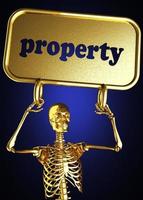 palavra de propriedade e esqueleto dourado foto