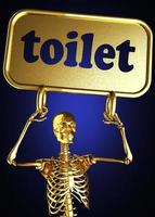 palavra de banheiro e esqueleto dourado foto