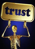 palavra de confiança e esqueleto dourado foto