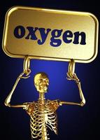 palavra de oxigênio e esqueleto dourado foto