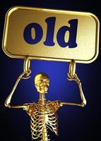 palavra velha e esqueleto dourado foto
