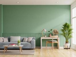 parede verde de maquete interior com sofá azul e mesa de trabalho na sala de estar.