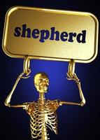 palavra pastor e esqueleto dourado foto