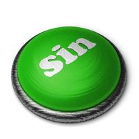 palavra pecado no botão verde isolado no branco foto