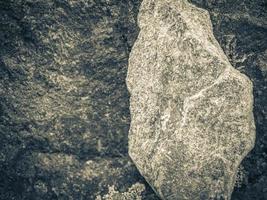 textura de pedra de pedra com musgo laranja e cores de líquen noruega. foto