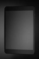 preto um tablet em um fundo escuro foto