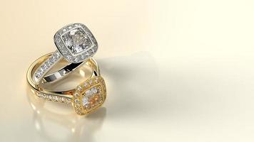 dois anéis de diamantes preciosos com pedra almofada foto