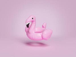 flutuador de flamingo suspenso no fundo rosa foto
