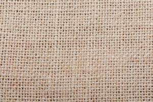 serapilheira, fundo de textura de pano de algodão granulado marrom de pano de saco foto