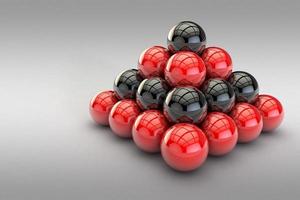 ilustração 3D, pirâmide de bolas vermelhas e pretas foto