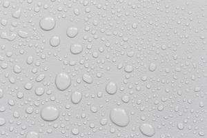 gotas de água em um fundo cinza foto