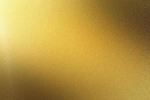 placa de metal dourada polida, fundo de textura abstrata foto