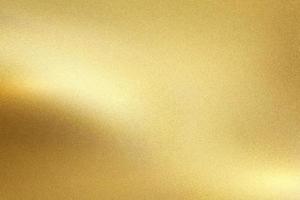 parede de metal de folha de ouro com luz brilhante brilhante, fundo de textura abstrata foto