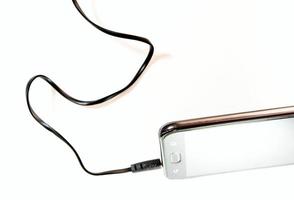 cabo de linha plana da tomada de áudio conectar ao telefone inteligente foto
