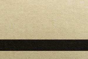textura da linha preta horizontal em papel de capa marrom, fundo abstrato foto
