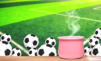 xícara de café com fundo de futebol foto