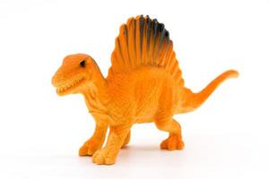 modelo de brinquedo de espinossauro em fundo branco foto