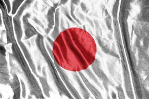 bandeira de pano do japão bandeira de cetim acenando textura de tecido da bandeira foto