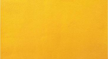grunge abstrato e técnica riscada parede de concreto de cor amarela, fundo de textura de material de superfície lisa de cimento, estilo loft vintage, pano de fundo retrô, construção de construção, piso de decoração foto