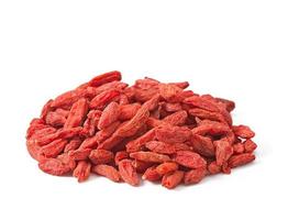 bagas vermelhas secas de goji em colher de pau foto