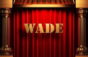 Wade palavra dourada na cortina vermelha foto