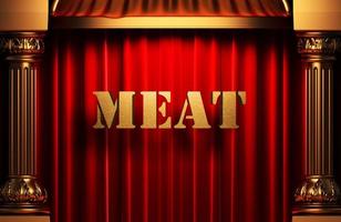 palavra de carne dourada na cortina vermelha foto