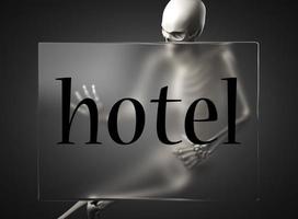 palavra de hotel em vidro e esqueleto foto