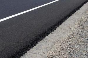 superfície de estrada de asfalto em cascalho de concreto. foto